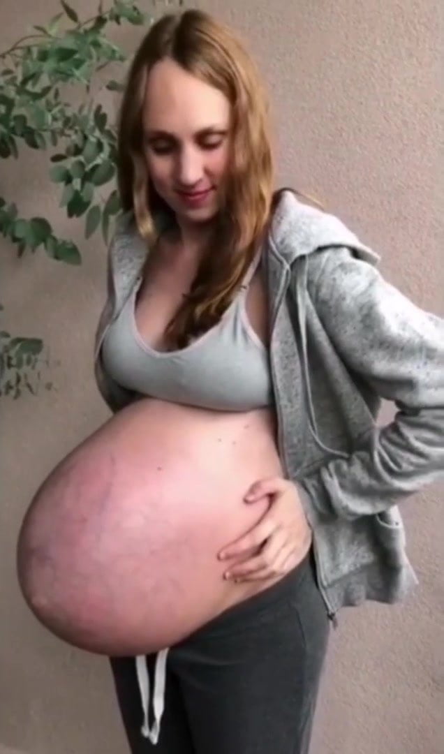 Pregnant girl showing belly